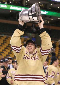 FOR ALL THE BEANS: Dorchester’s own Kevin Hayes was named tournament MVP as the Boston College Eagles defeated Northeastern University 4-1 to capture their fifth straight Beanpot title on Monday night. Above, Hayes — who scored a goal in the game— hoisted the Beanpot trophy aloft on the ice at the TD Garden. More, page 8. 	Photo by John Quackenbos / Boston College